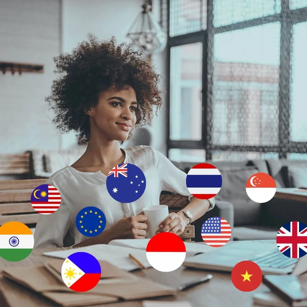 Professional working in an office surrounded by international flags representing global talent access